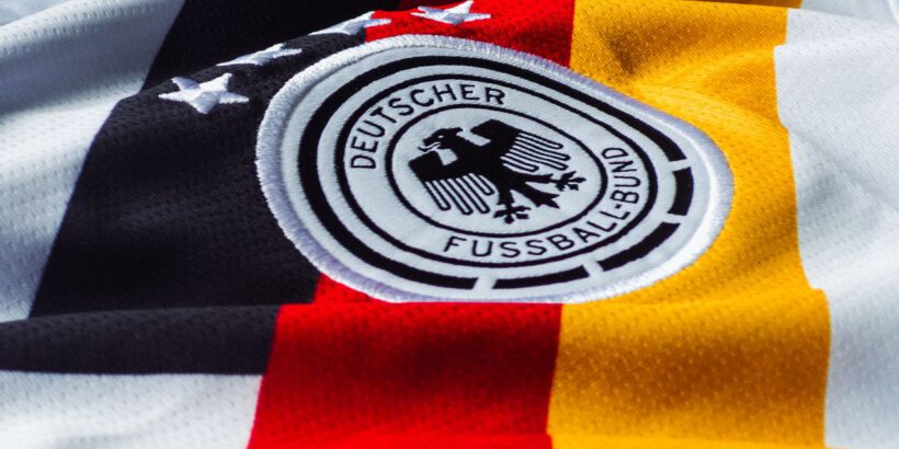 Detailed view of the German national football team jersey with emblem.